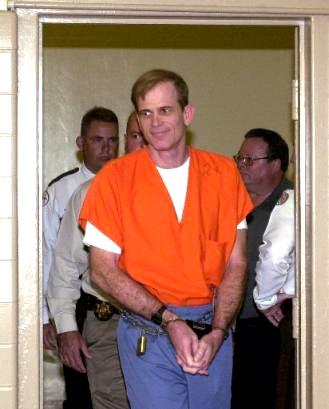 Paul Hill is escorted into a room at the Florida State Prison in Starke, Fla., Tuesday, Sept. 2, 2003, where he held a news conference. Hill is scheduled to be executed Wednesday for the slayings of Dr. John Britton and his escort James Barrett outside an abortion clinic in Pensacola, Fla., in 1994. (AP Photo/Peter Cosgrove)